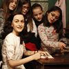 Children watch the wax figure of Anne Frank and their hideout reconstruction at Madame Tussauds on March 9 in Berlin, Germany.